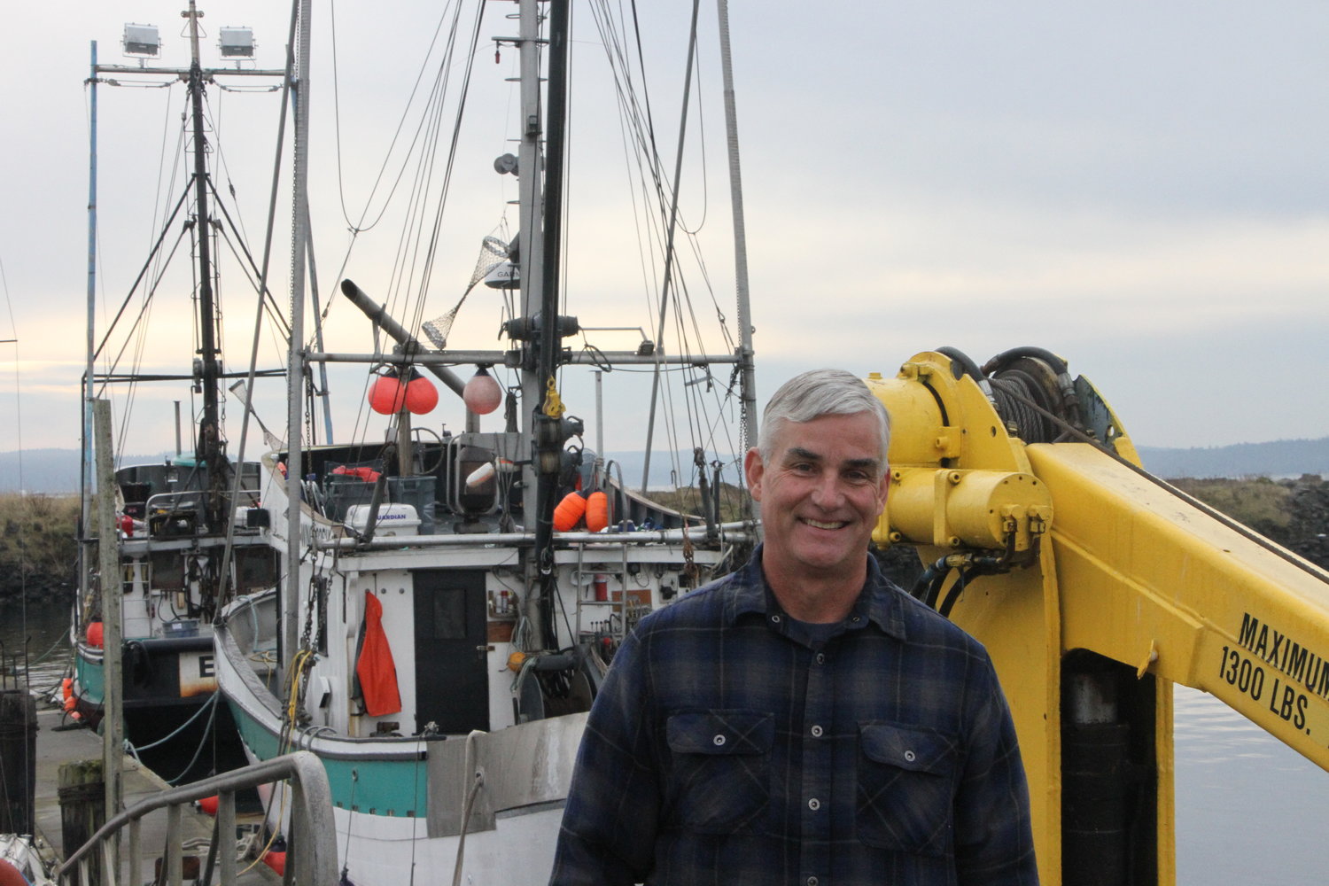 Scott Kimmel, owner of New Day Fisheries stands in front of his fishing boats, Adriatic and Ellie-J.